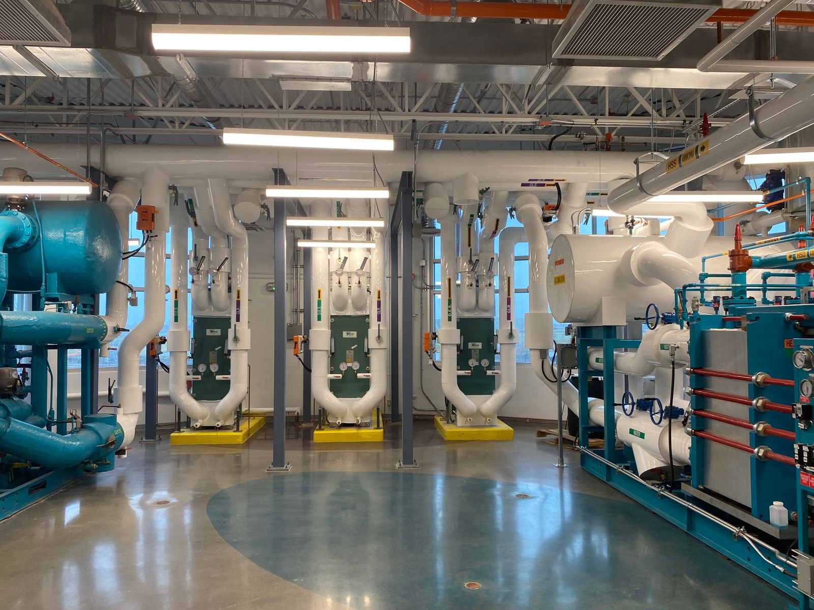 Commercial chiller plant room with mechanical piping