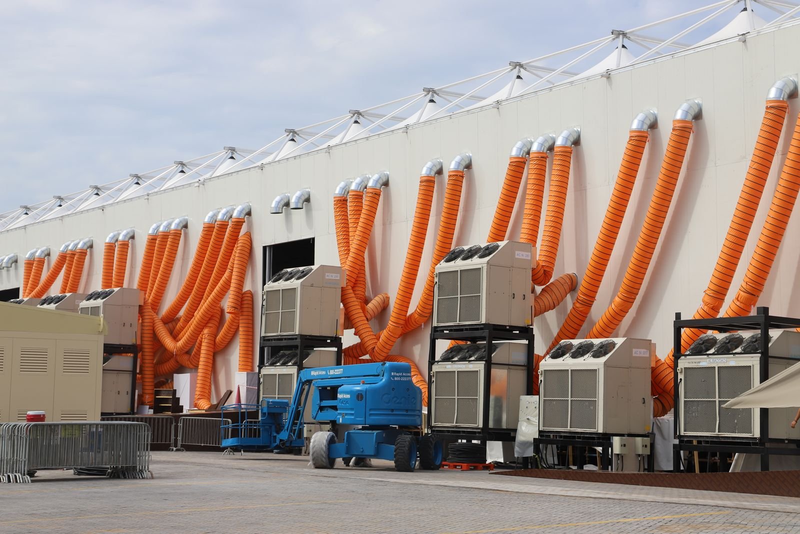 Temporary spot-cooling units connected via flexible ducting